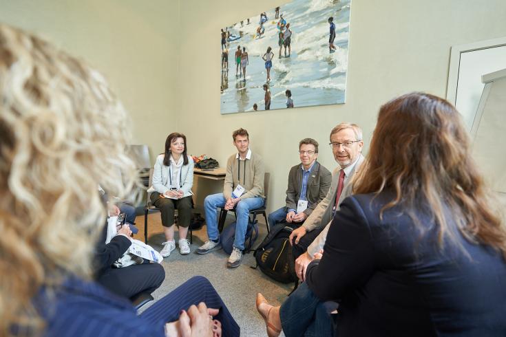 Group of people sitting in a circle